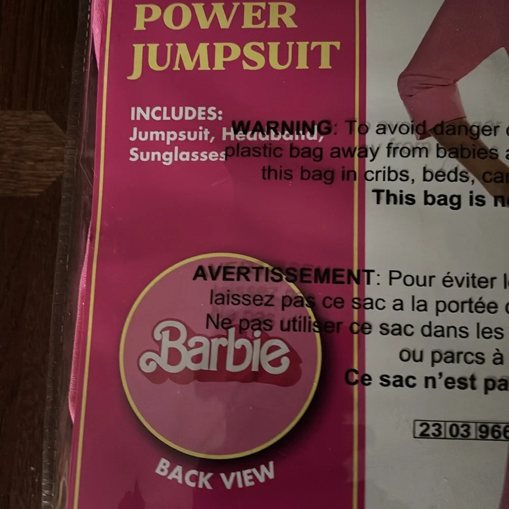 NWT  Spirit Halloween Barbie the Movie Kids Pink Power Jumpsuit size large 12-13